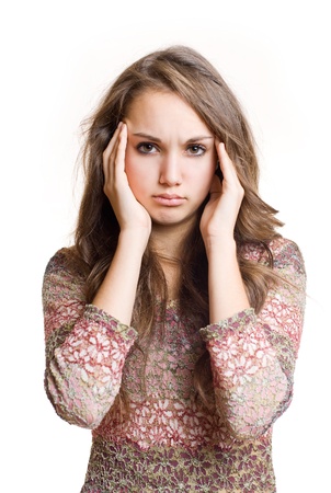 Beautiful young brunette girl showing gesture signs of headache.の写真素材