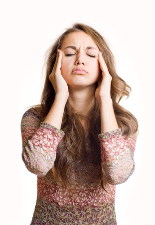 Beautiful young brunette girl having terrible headache.の写真素材
