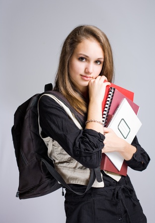 Half length portrait of a beautiful friendly young student girl.の写真素材