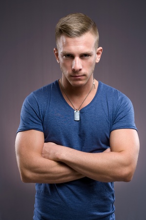 Portrait of masculine tough looking young man with serious expression and pose.の写真素材