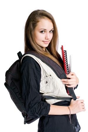 Portrait of a beautiful student girl with black backpack and books.の写真素材
