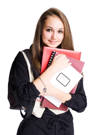 Portrait of a cute young brunette student girl with exercise books.の写真素材