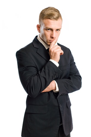 Portrait of a confident young businessman in thinking gesture.の写真素材