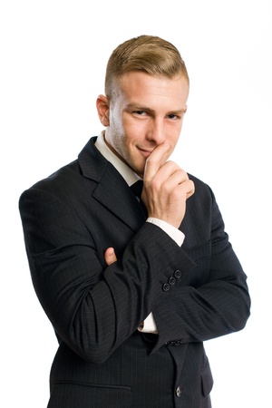 Portrait of a confident young businessman with mischievous smile.の写真素材