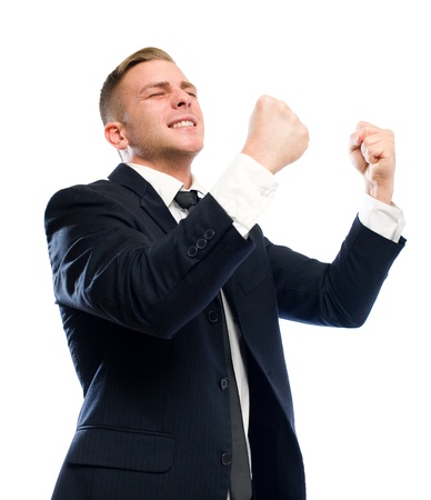 Young businessman gesturing victory, isolated on white background.の写真素材