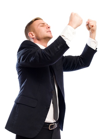 Portrait of a confident young businessman gesturing victoryの写真素材