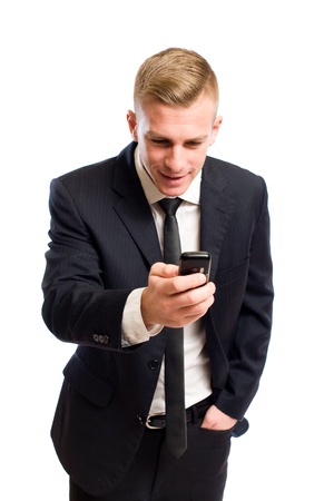 Portrait of excited happy young businessman checking his mobile phone.の写真素材