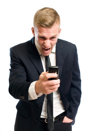 Portrait of scary evil boss screaming you are fired into mobile phone.の写真素材