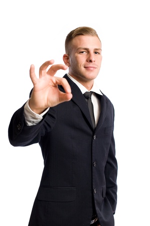 Portrait of a  young businessman gesturing an OK sign.の写真素材
