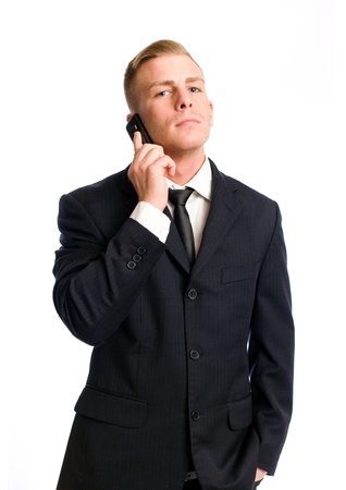 Portrait of a handsome young businesman being busy on the phone.の写真素材