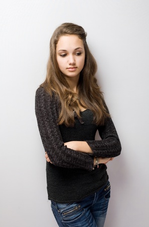 Half length portrait of a thoughtful young brunette.の写真素材