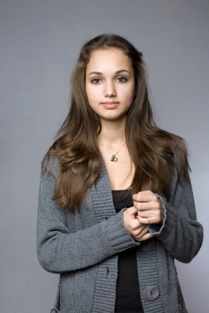 Portrait of a young brunette beauty in warm winter outfitの写真素材