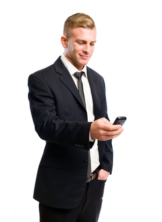 Half legth portrait of a successful young businessman on his cellphone.の写真素材