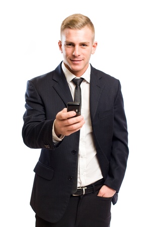 Portrait of a happy handsome young businessman using mobile phone の写真素材
