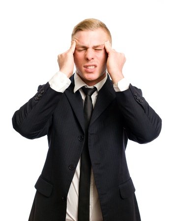 Elegant young businessman with gesture and posture suggesting pain, headache の写真素材