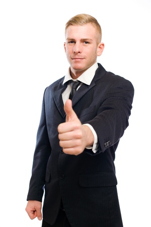 Elegant blond businessman showing thumbs up の写真素材