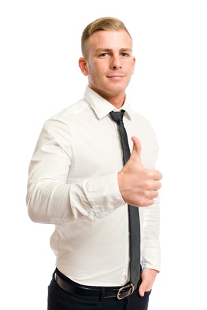 Confident looking young businessman showing big thumbs up の写真素材