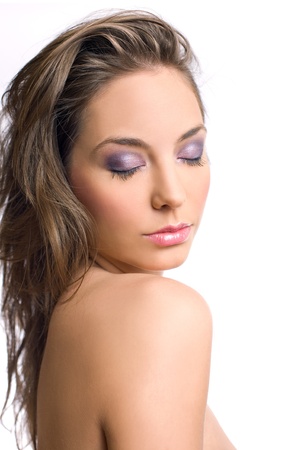 Beautiful brunette in elegant makeup isloated on white background.の写真素材