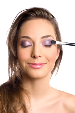 Cosmetics concept with beautiful young brunette woman and makeup tools.の写真素材