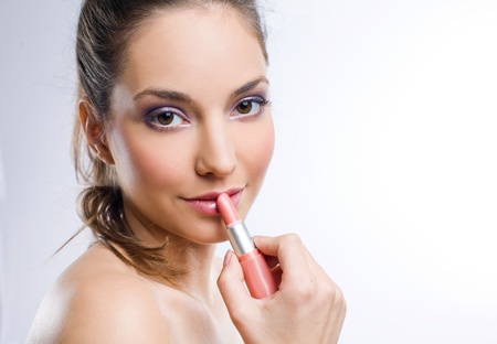 Portrait of a pretty young brunette woman with lipstick の写真素材