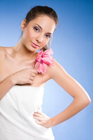 Portrait of a gorgeous relaxed spa girl wrapped in towels の写真素材