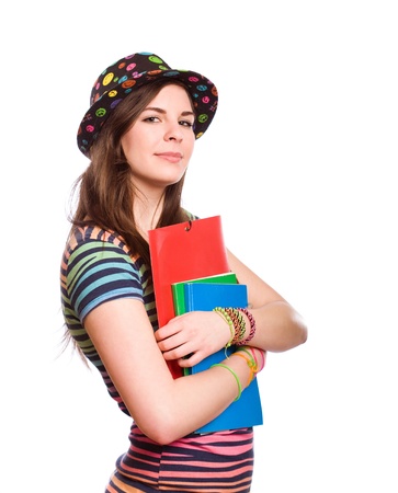 Half length portrait of a confident student girl in very colorful clothes, isolated on white background の写真素材