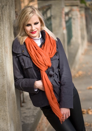 Portrait of beautiful young blond fashion model outdoors dressed for cool weather の写真素材