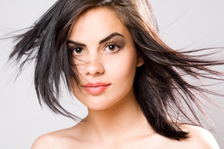 Closeup portrait of a brunette beauty in elegant makeup.の写真素材