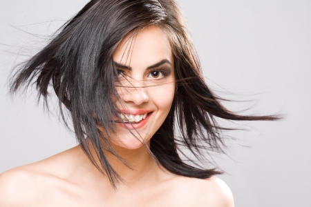 Closeup portrait of a brunette beauty in elegant makeup.の写真素材