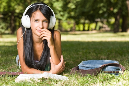 Portrait ofa  gorgeous young relaxed student in the park.の写真素材