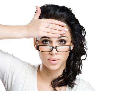 Shocking message, portrait of a beautiful young brunette woman with amazed facial expression. の写真素材