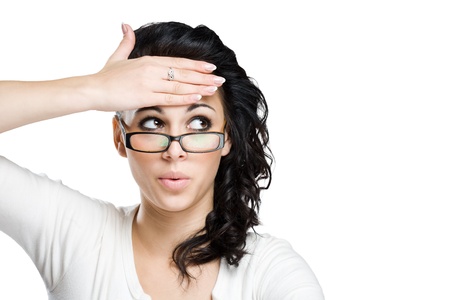 Portrait of a gorgeous young brunette woman with shocked facial expression. の写真素材