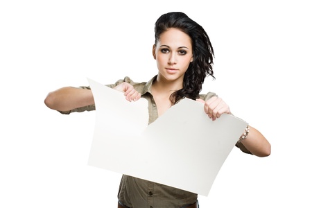 Let's halve this, beautiful young brunette woman tearing empty banner in half.の写真素材