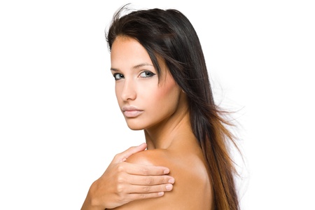 Portrait of a tanned brunette beauty isolated on white background.の写真素材