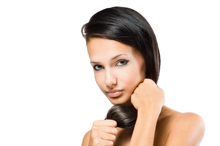 Portrait of a brunette beauty with strong healthy shiny hair.の写真素材