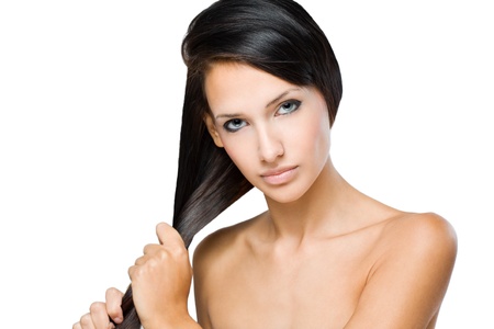 Portrait of a brunette beauty with strong healthy shiny hair.の写真素材