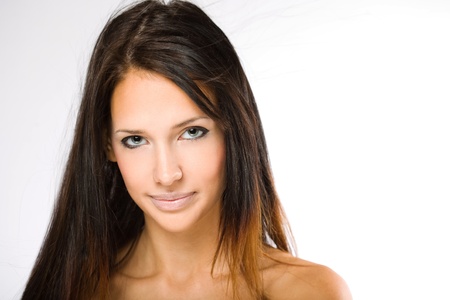 Portrait of a beautiful tanned young brunette woman.の写真素材