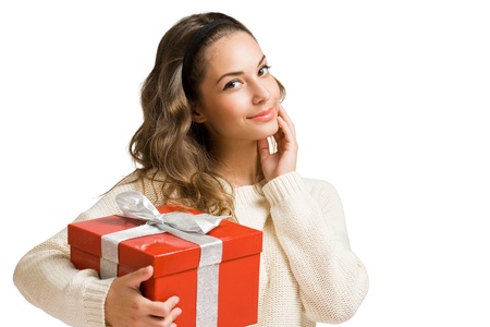 Portrait of a brunette beauty with gift boxの写真素材