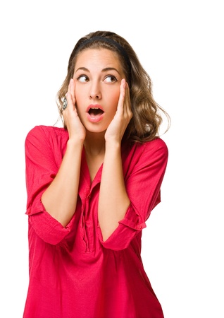 Half length portrait of a shocked looking young brunette woman.の写真素材