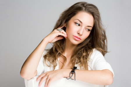 Portrait of a thoughtful contemplative young brunette beauty の写真素材
