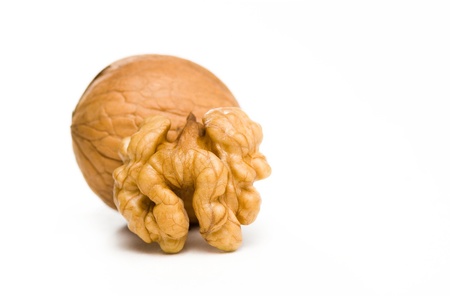Macro shot of ripe walnut on white background.の写真素材