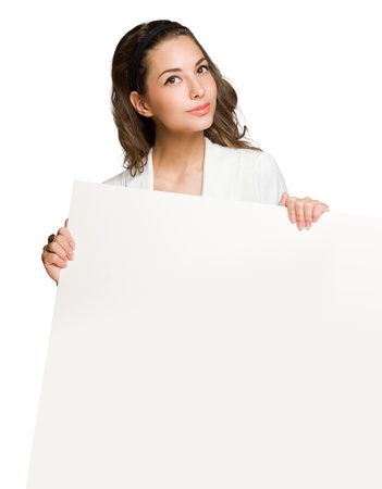 Brunette beauty holding large white empty billboard.の写真素材