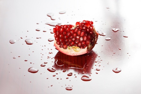 Studio shot of appetizing juicy fresh pomegranate.の写真素材