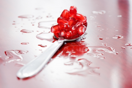 Closeup shot of juicy fresh pomegranate seeds.の写真素材