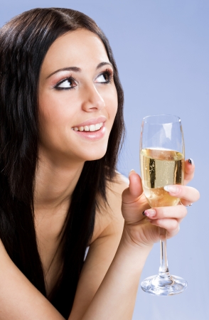 Gorgeous young festive brunette beauty with champagne.の写真素材