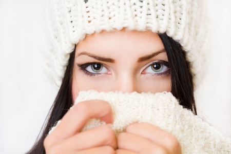 Closeup portrait of a shy winter fashion beauty の写真素材