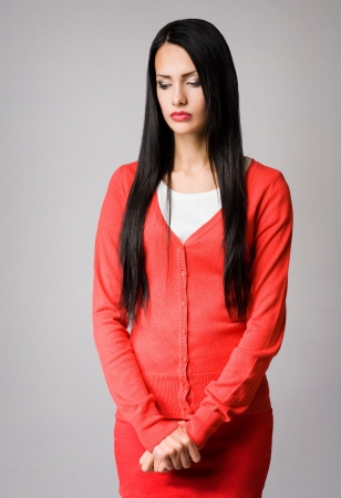 Half length portrait of attractive slender young business woman in pensive pose の写真素材