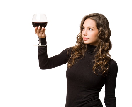 Beautiful young brunette woman enjoying quality wine.の写真素材