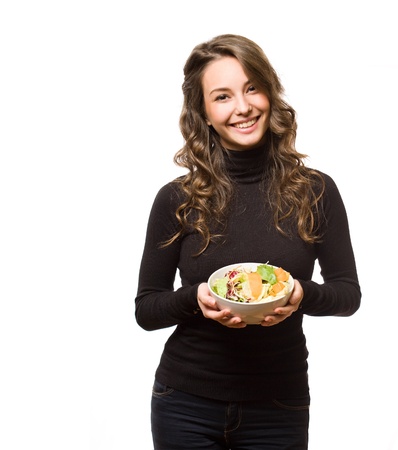Portrait of healthy eating beautiful young brunette woman.の写真素材