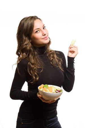 Portrait of an attractive brunette woman with a bowl of salad.の写真素材
